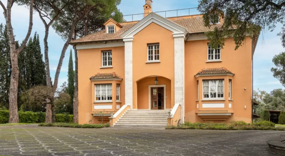 The front of the main house is fronted by a large motor court. The compound includes a second residence for guests, family or staff.