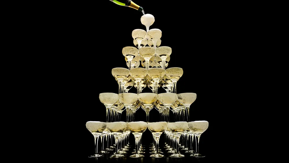 Photo of Champagne glasses stacked on top of one another
