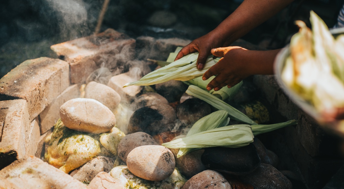 people making a traditional dish of Peru