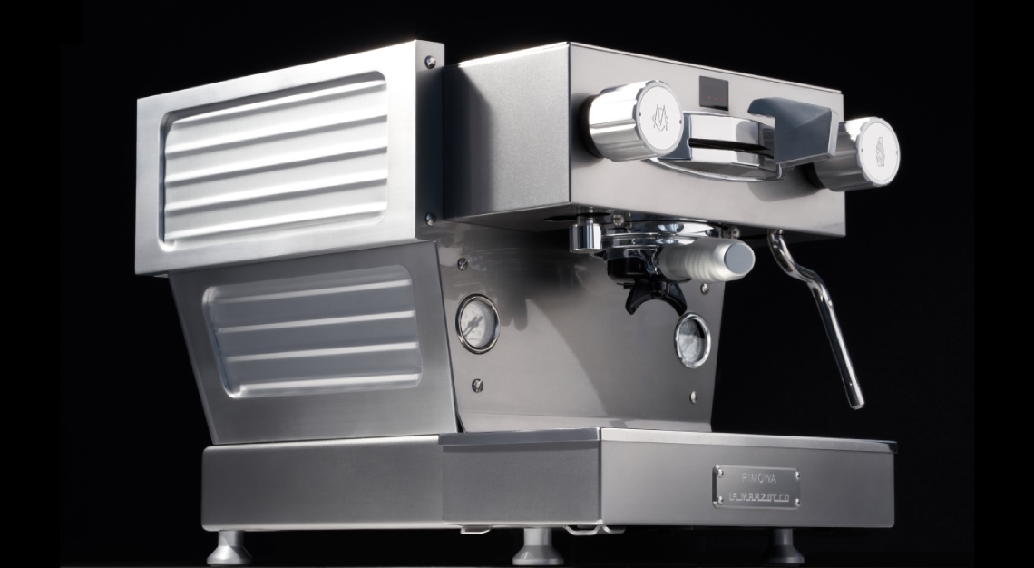front view of Rimowa and La Marzocco espresso machine
