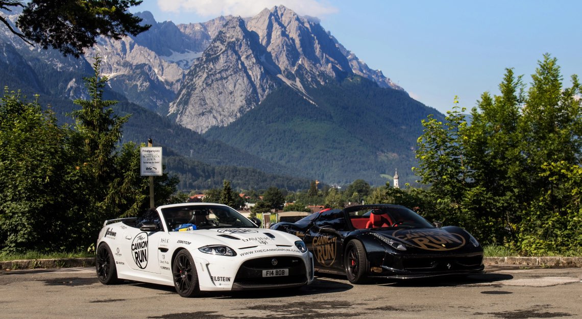 two sports vehicles at a car rally holiday called The Cannon Run