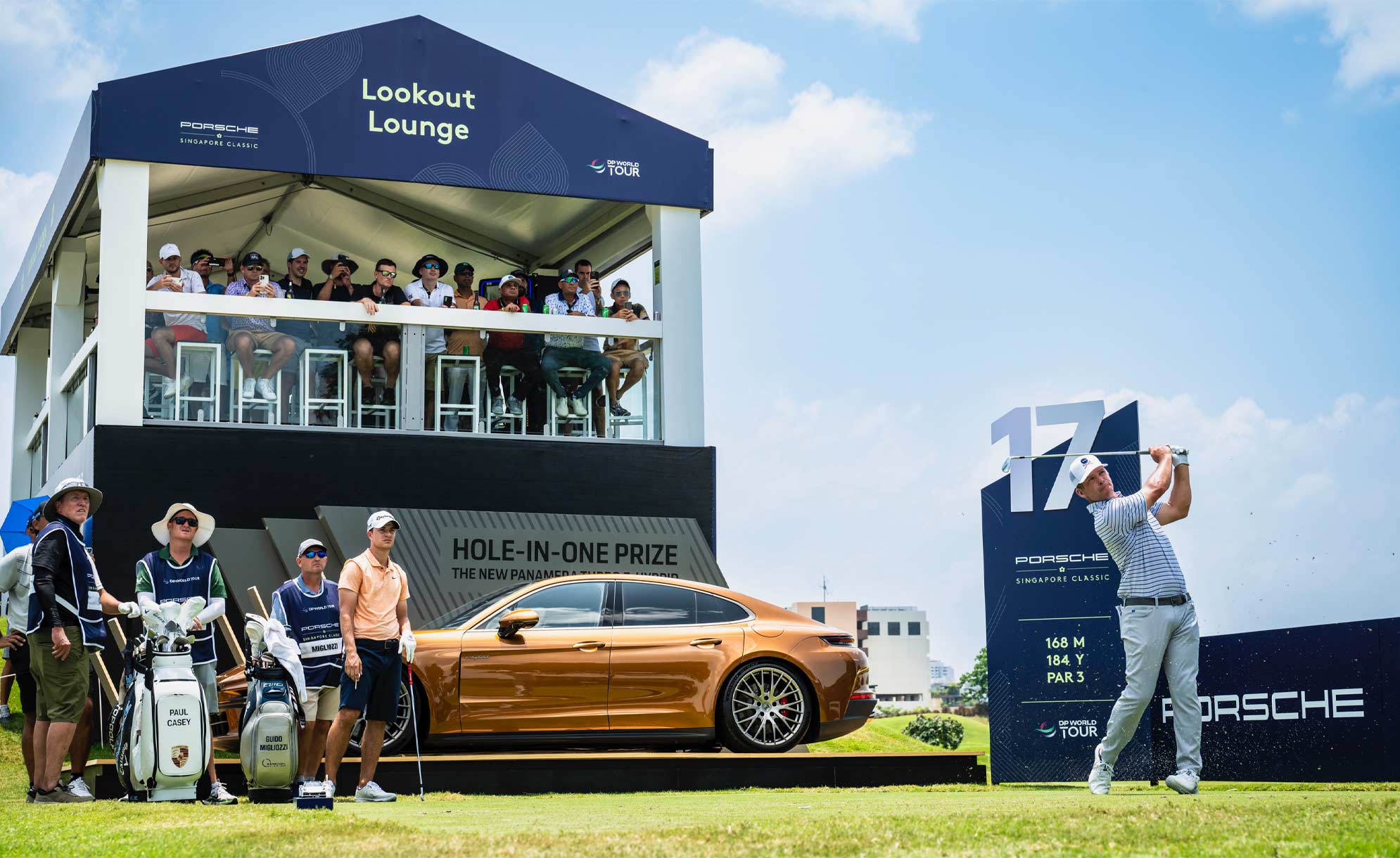 golfer swinging to win a Porsche Panamera at the Porsche Singapore Classic