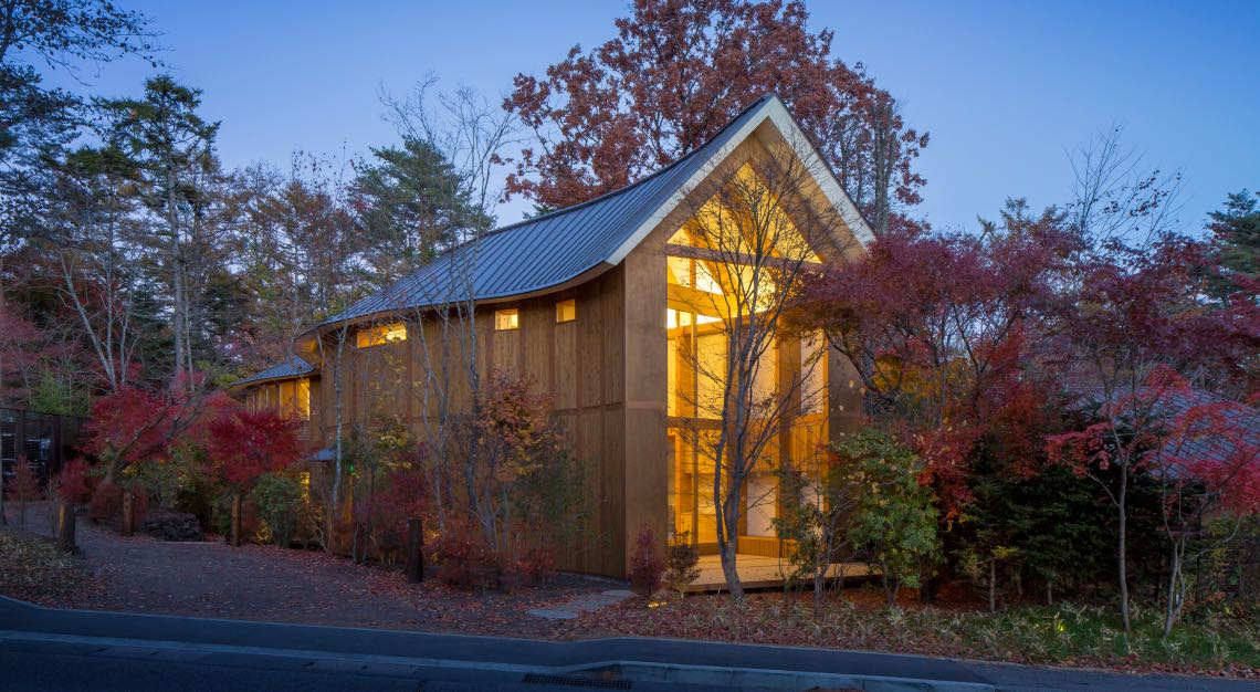 Photo of a wooden house in a forest