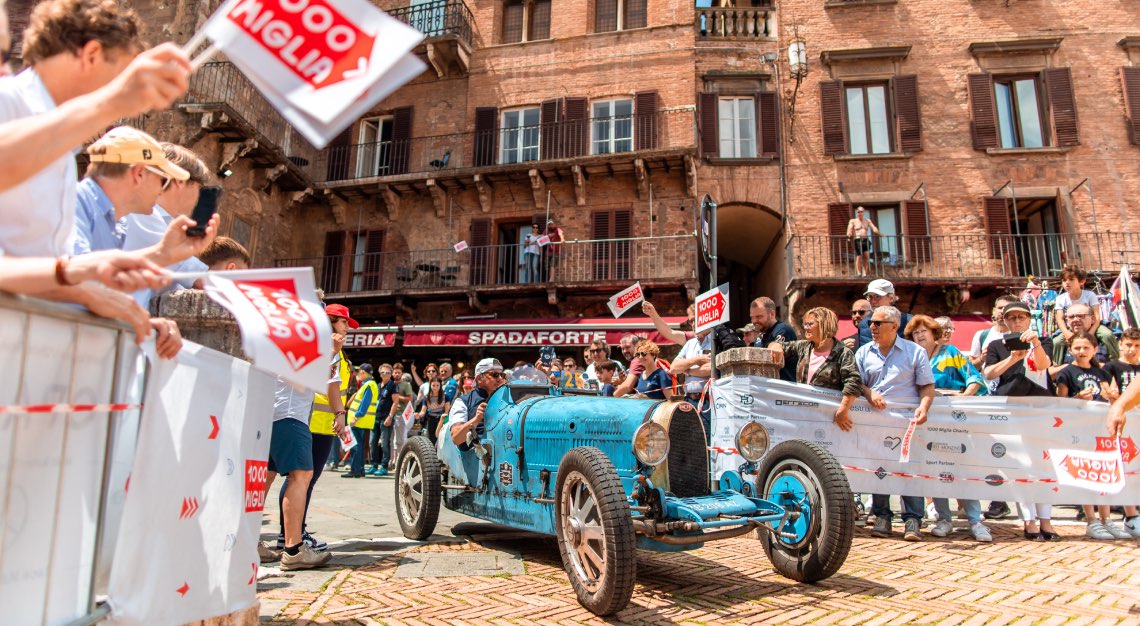 a vintage vehicle at the mille miglia