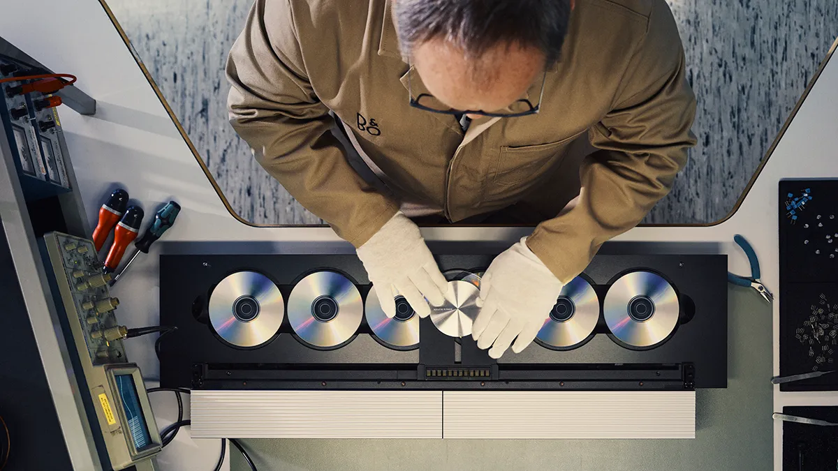 technician works on the Bang & Olufsen cd player