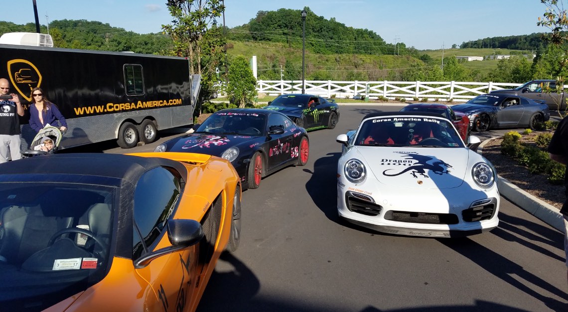 four sports car driving at a car rally holiday called the corsa rally