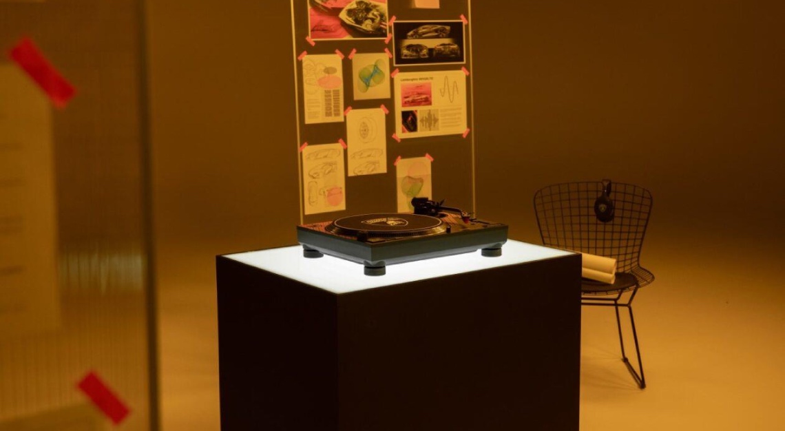 the Lamborghini and Technics turntable in a red-tinted room