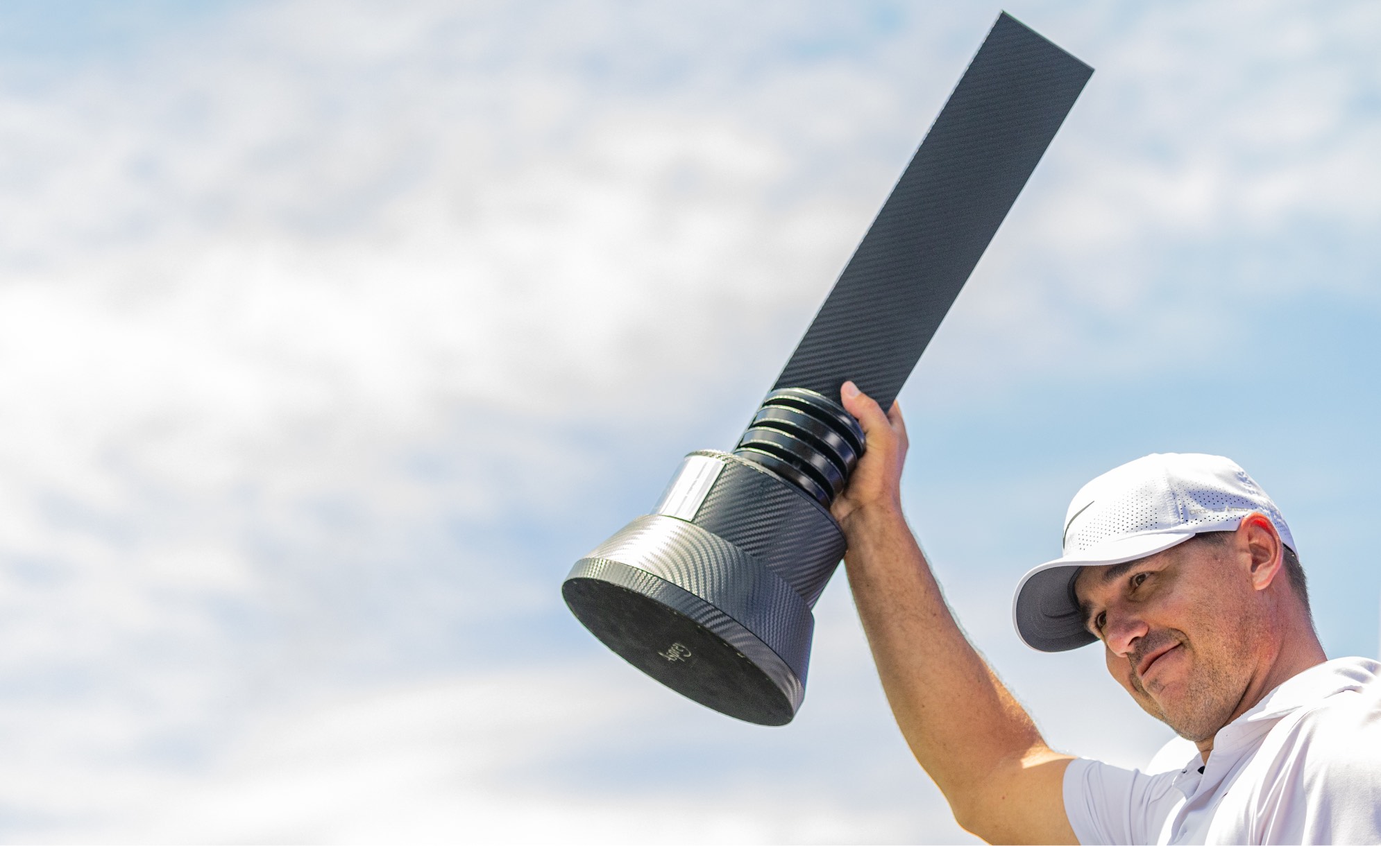 Individual Champion Captain Brooks Koepka of Smash GC celebrates with the trophy after the final round of LIV Golf Singapore at Sentosa Golf Club