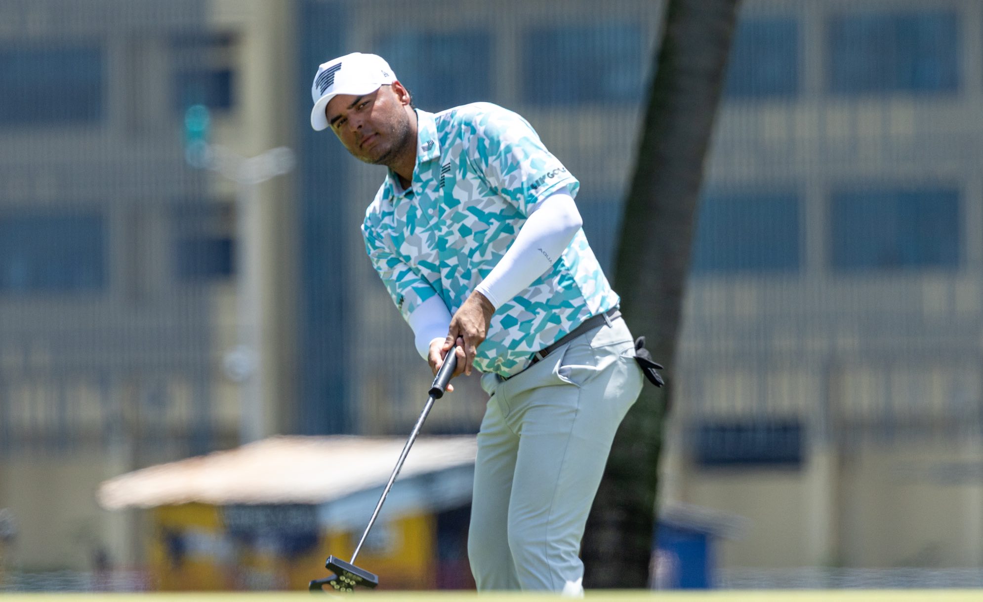 Sebastián Muñoz of Torque GC makes his putt on the third green during the first round of LIV Golf Singapore at Sentosa Golf Club